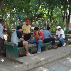 Men playing checkers in the park