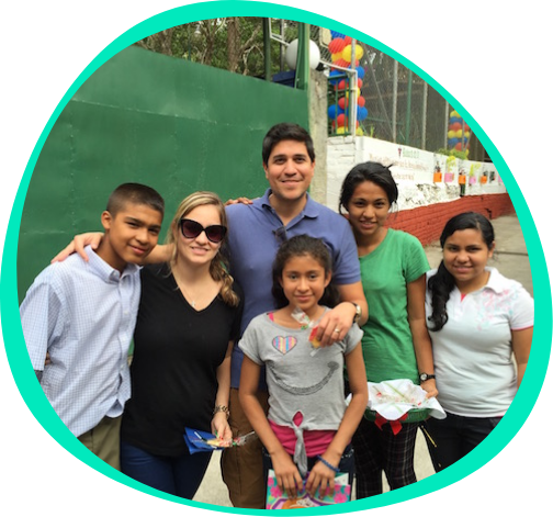 Image of Luis Majano and his wife with the foundation kids